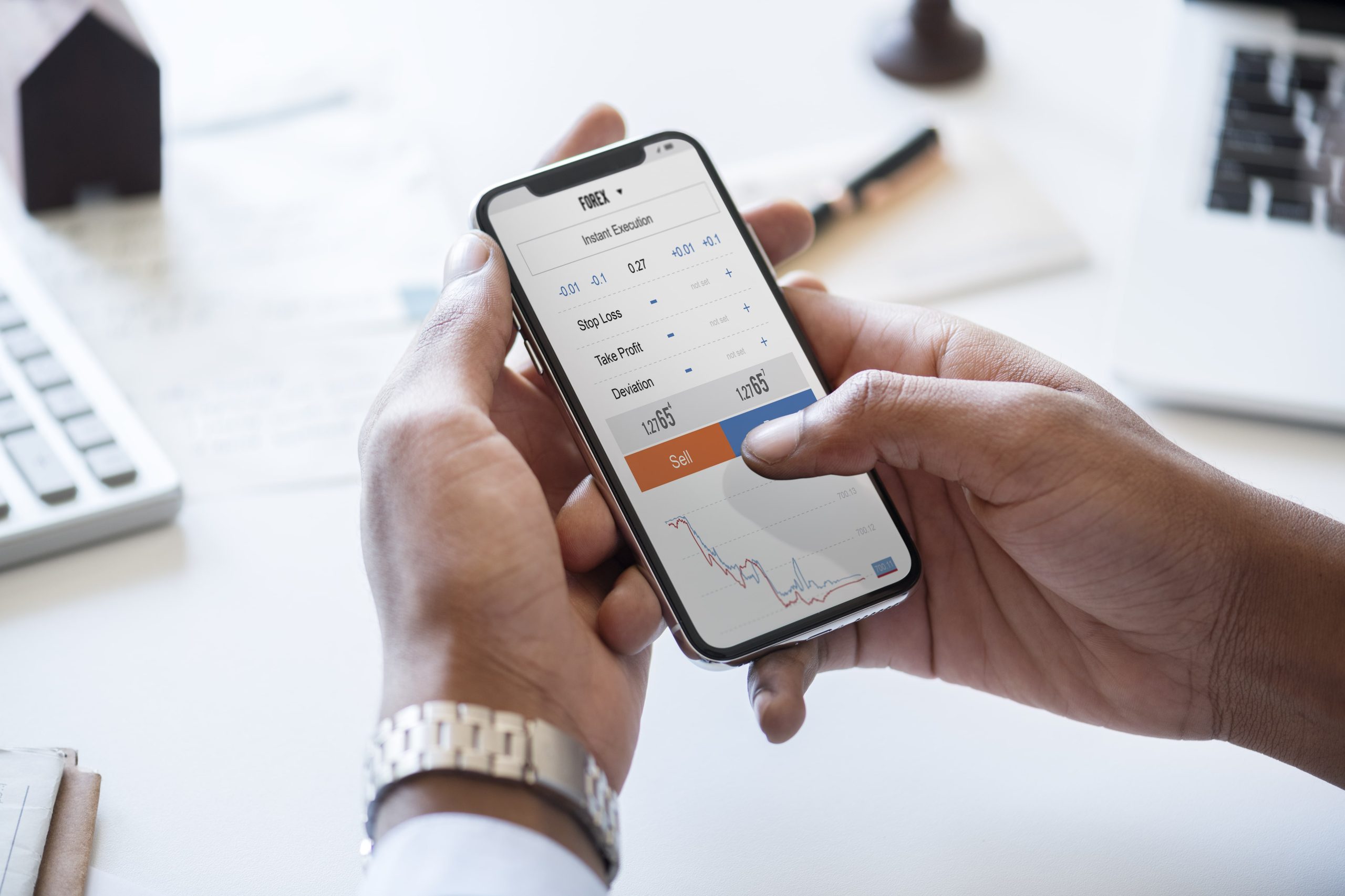 businessman checking stock market online min scaled